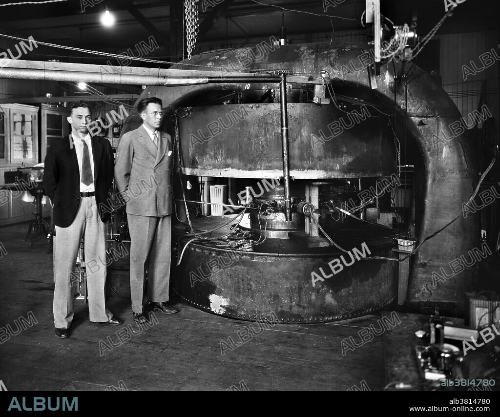 Livingston and Lawrence beside the 27 inch Cyclotron built in 1934. Milton Stanley Livingston (May 25, 1905 - August 25, 1986) was an American accelerator physicist, co-inventor of the cyclotron with Ernest Lawrence, and co-discoverer with Ernest Courant and Hartland Snyder of the strong focusing principle, which allowed development of modern large-scale particle accelerators. He built cyclotrons at the University of California, Cornell University and the Massachusetts Institute of Technology. During WWII, he served in the operations research group at the Office of Naval Research. Ernest Orlando Lawrence (August 8, 1901 - August 27, 1958) was an American physicist and Nobel Laureate, known for his invention, utilization, and improvement of the cyclotron atom-smasher beginning in 1929, based on his studies of the works of Rolf Wideroe, and his later work in uranium-isotope separation for the Manhattan Project.