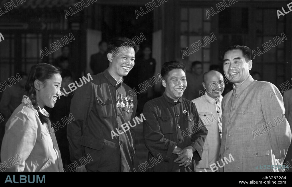 First Session of the First National People's Congress, October 1954. Chou En-lai (right) with (l to r) model workers and deputies of Peking Liu Shin-mei and Liu Teh-chen, Huang Jun-ping, and deputy of Harbin, Che Hsieng-chen.