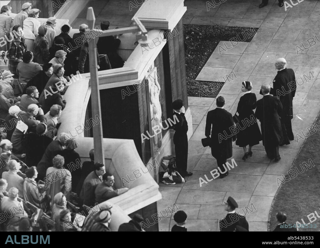 Queen Unveils Merchant Navy Memorial On Tower Hill -- The Queen after unveiling the memorial. About 20,000 people saw the Queen, who was accompanied by the Duke of Edinburgh, unveil the Merchant Navy Memorial on Tower Hill, London, to-day (Saturday). She was accompanied by the Duke of Edinburgh. The memorial, built by the Imperial war Graves Commission to the design of Sir Edward Maufe. RA, Honours 24,000 officers and men of the Merchant Navy and fishing fleets. It is and extension of the 1914.