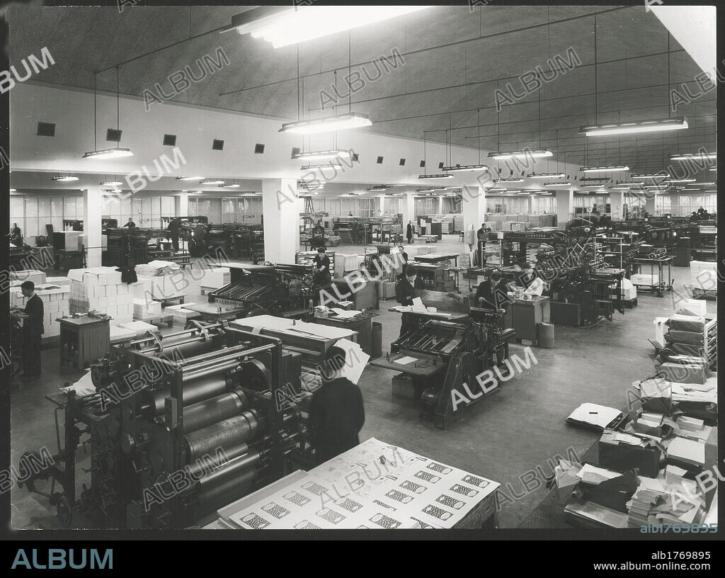 Workers in the typographical section of Mondadori. Men at work at the typographical section of the San Michele building of the publishing company Mondadori. Verona.