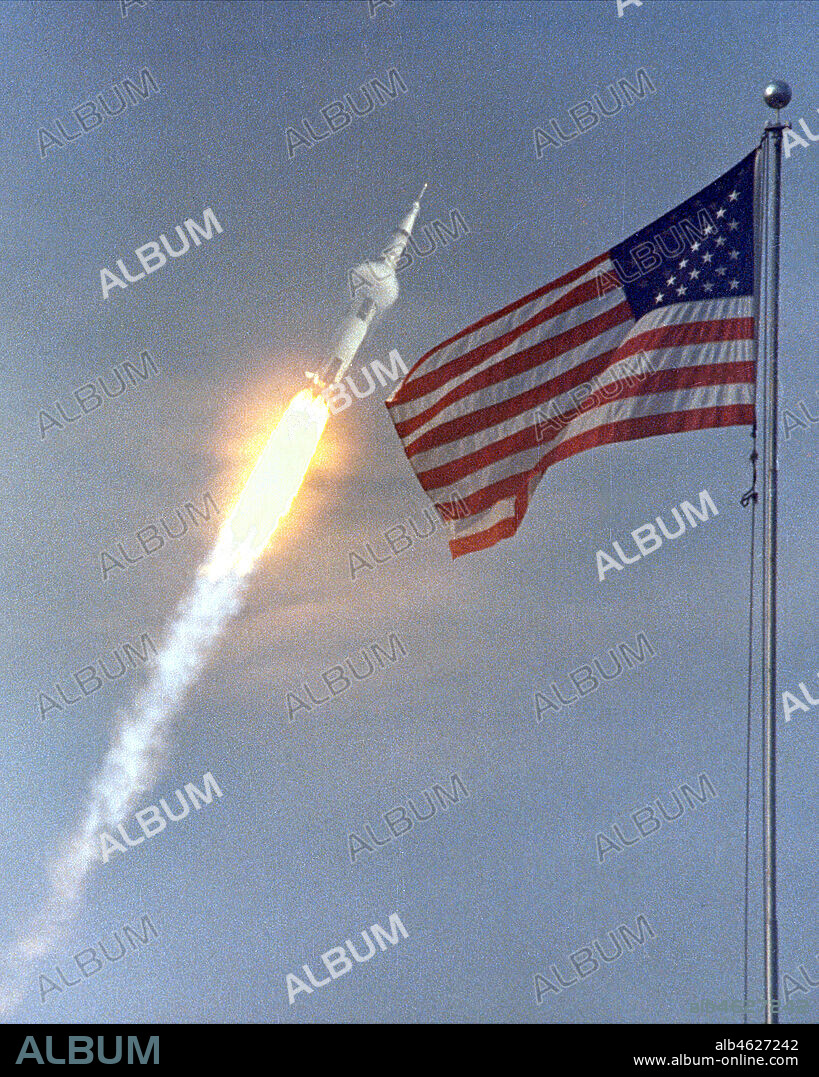 Apollo 11 - NASA, 1969. A Saturn V rocket launches the Apollo 11 crew on the first moon landing mission, July 16, 1969. .