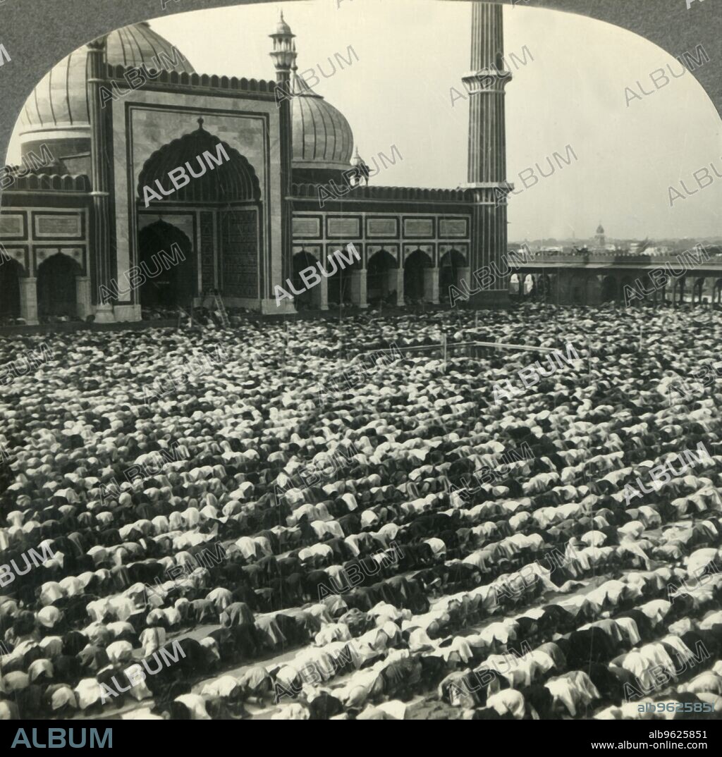 'Devout Mohammedans Prostrate at Prayer Time - Jama Masjid, India's Greatest Mosque, Delhi', c1930s. Built by Mughal Emperor Shah Jahan between 1650 and 1656  red sandstone and white marble, the courtyard can accommodate more than 25,000 people. From "Tour of the World". [Keystone View Company, Meadville, Pa., New York, Chicago, London].