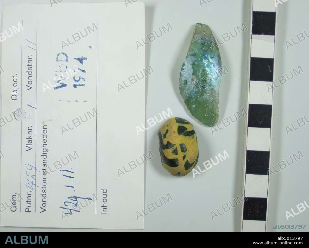 glass fragment, 1 shard wall, light greenish glass with large number of small vesicles, iridescent surface, 1 fragment of bead, flattened spherical, polychrome translucent dark green with yellow, type Callmer B054O, length axial 1.63 cm, diameter maximum 2.65 cm, fragments, glass, length axially 1.63 cm, diameter maximum 2.65 cm, Netherlands, Utrecht, Wijk bij Duurstede, Wijk bij Duurstede.