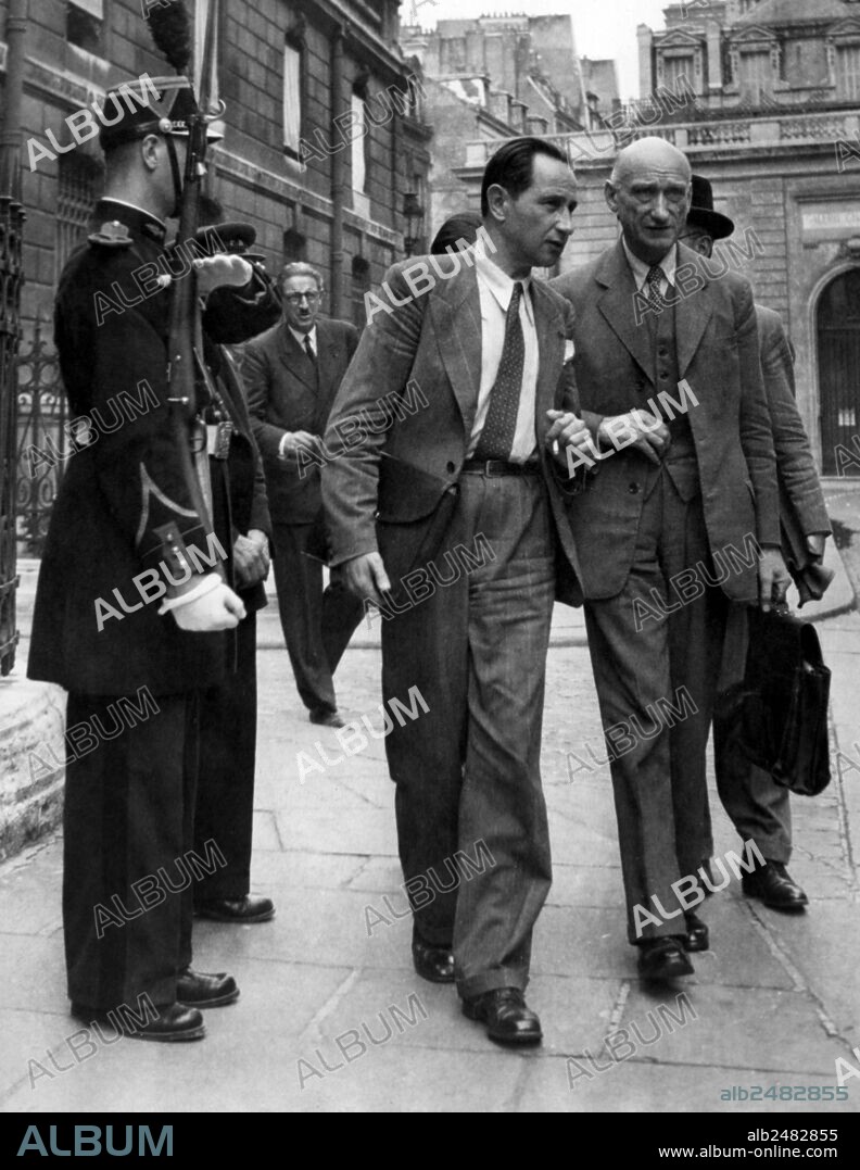 Robert Schuman and Paul Bechard leaving the Elysee Palace, after a council of ministers, august 20, 1947. Paris.