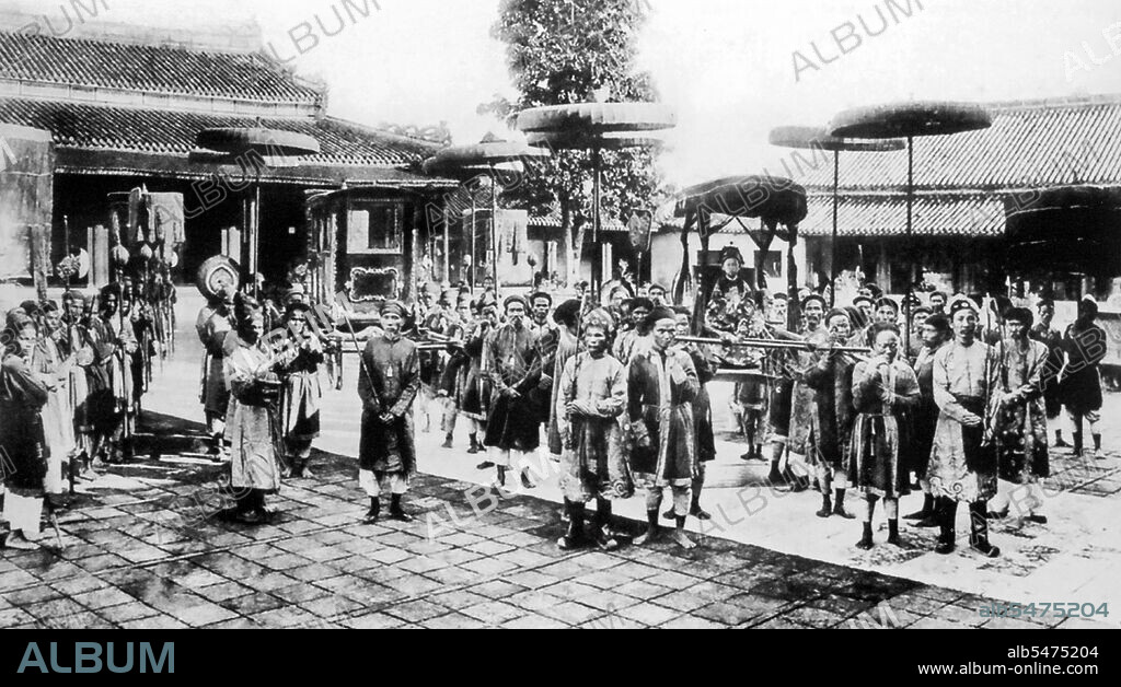 Emperor Duy Tan (Nguyen Phuc Vinh San, 14 August 1899 - 25 December 1945), was a child Emperor of the Nguyen Dynasty and reigned for nine years between 1907 and 1916. His name was Prince Nguyen Phuc Vinh San and was son of the Thanh Thai Emperor. Because of his opposition to French rule and his erratic, depraved actions (which some speculate were feigned to shield his opposition from the French) Thanh Thai was declared insane and exiled to Vung Tau in 1907. The French decided to pass the throne to his son Nguyen Phuc Vinh San, who was only seven years old, because they thought someone so young would be easily influenced and controlled, and could be raised to be pro-French. This proved to be a big mistake on the part of the French. Nguyen Phuc Vinh San was enthroned with the reign name of Duy Tan, meaning 'friend of reform' and in time would prove unwilling to live up to this name. As he became older he noticed that, even though he was treated as the Emperor, it was the colonial authorities who were actually obeyed. As he became a teenager, Emperor Duy Tan came under the influence of the mandarin Tran Cao Van, who was very much opposed to the colonial administration. Emperor Duy Tan began to plan a secret rebellion with Tran Cao Van and others to overthrow the French. In 1916, while France was preoccupied with fighting World War I, Emperor Duy Tan was smuggled out of the Forbidden City with Tran Cao Van to call upon the people to rise up against the French. However, the secret was revealed and France immediately sent troops, and after only a few days they were betrayed and captured by the French authorities. Because of his age and in order to avoid a worse situation, Emperor Duy Tan was deposed and exiled instead of being killed. Tran Cao Van and the rest of the revolutionaries were all beheaded.