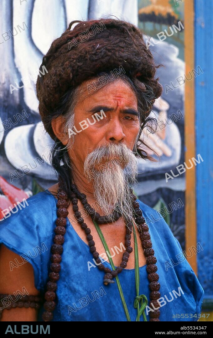 They are known, variously, as sadhus (saints, or 'good ones'), yogis (ascetic practitioners), fakirs (ascetic seeker after the Truth) and sannyasins (wandering mendicants and ascetics). They are the ascetic – and often eccentric – practitioners of an austere form of Hinduism. Sworn to cast off earthly desires, some choose to live as anchorites in the wilderness. Others are of a less retiring disposition, especially in the towns and temples of Nepal's Kathmandu Valley. If the Vale of Kathmandu seems to boast more than its share of sadhus and yogis, this is because of the number and importance of Hindu temples in the region. The most important temple of Vishnu in the valley is Changunarayan, and here the visitor will find many Vaishnavite ascetics. Likewise, the most important temple for followers of Shiva is the temple at Pashupatinath. Vishnu, also known as Narayan, can be identified by his four arms holding a sanka (sea shell), a chakra (round weapon), a gada (stick-like weapon) and a padma (lotus flower). The best-known incarnation of Vishnu is Krishna, and his animal is the mythical Garuda. Shiva is often represented by the lingam, or phallus, as a symbol of his creative side. His animal is the bull, Nandi, and his weapon is the trisul, or trident. According to Hindu mythology Shiva is supposed to live in the Himalayas and wears a garland of snakes. He is also said to smoke a lot of bhang, or hashish.