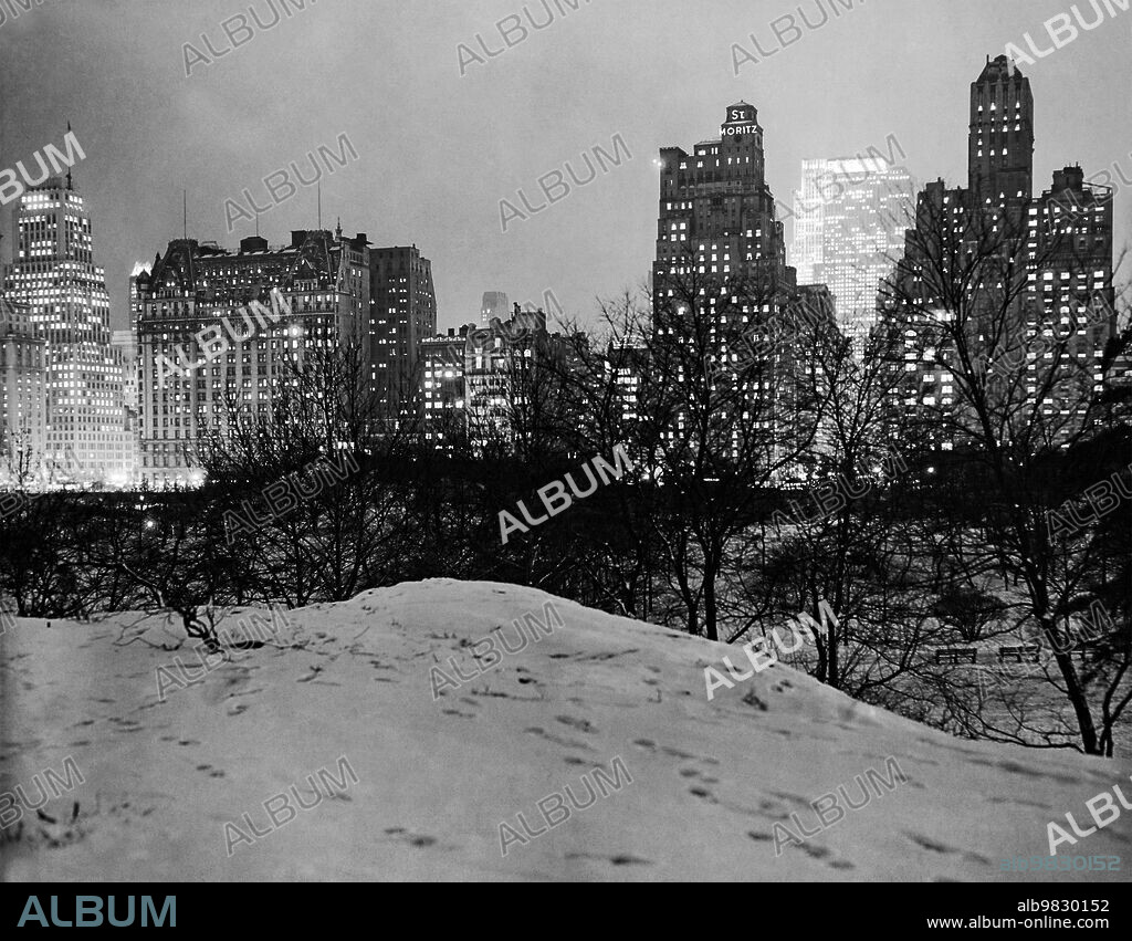 New York, New York: c.1930, St. Moritz Hotel and 59th St. from Central Park. The Plaza Hotel is at the left.