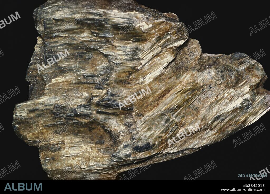 Anthophyllite, a silicate mineral formed in metamorphosed magnesium-rich rocks.  Fibrous anthophyllite has been used as asbestos.