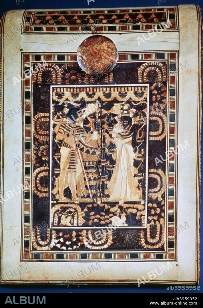 Lid of a coffer showing Tutankhamun and his wife Ankhesenamun in a garden, 14th century BC. The lower frieze shows a servant girl and man picking mandrake, the fruit of love. From the collection of the Egyptian National Museum, Cairo, Egypt.