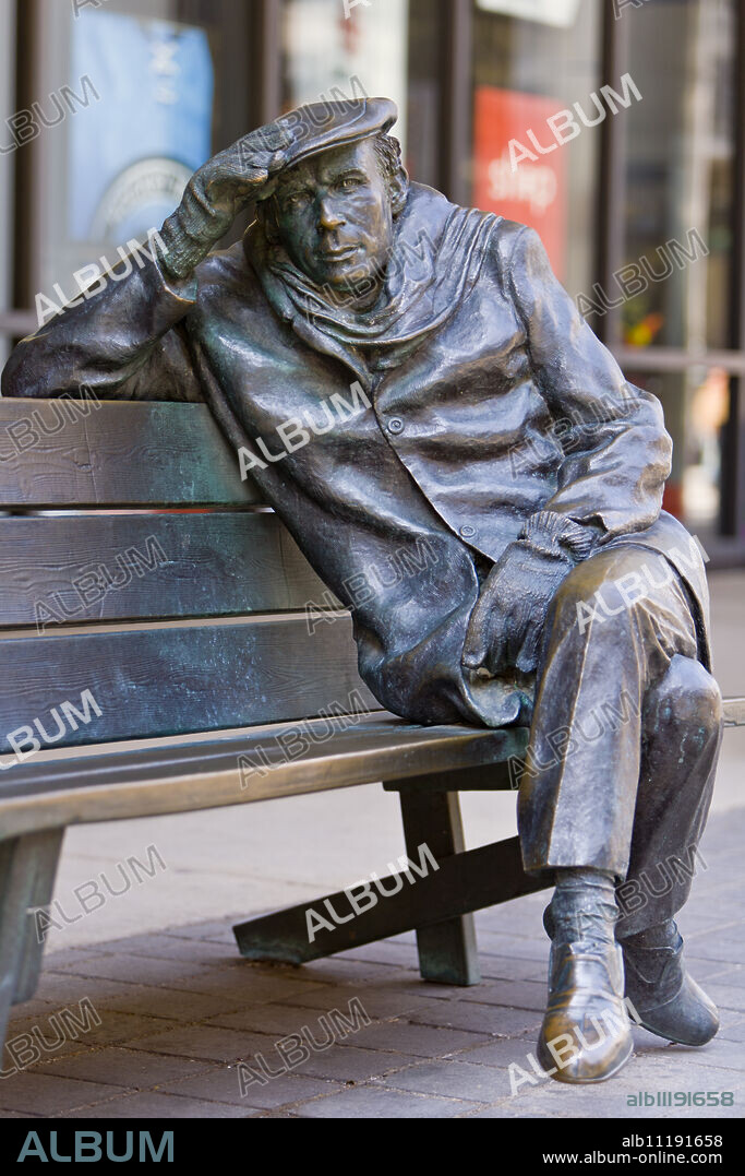 Life-sized bronze statue of Glenn Gould the pianist, by Ruth Abernethy, sitting on a park bench outside the CBC Building in downtown Toronto, Toronto, Ontario, Canada, North America.