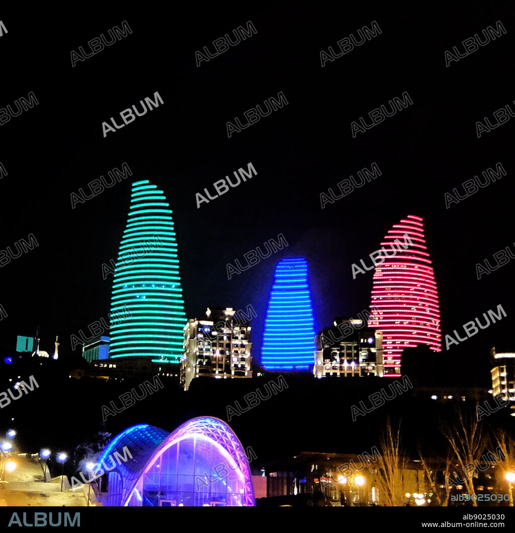 Flame Towers, a trio of skyscrapers in Baku, Azerbaijan. with a height of 182 m (597 ft). the Towers symbolize the long history of fire worshippers that considered Azerbaijan as a birthplace for the prophet Zoroaster. The buildings consist of 130 residential apartments over 33 floors, a hotel tower that consists of 250 rooms and 61 serviced apartments, and office blocks. Construction began in 2007, with completion in 2012. HOK was the architect for the project, DIA Holdings served as the design-build contractor, and Hill International provided project management.
