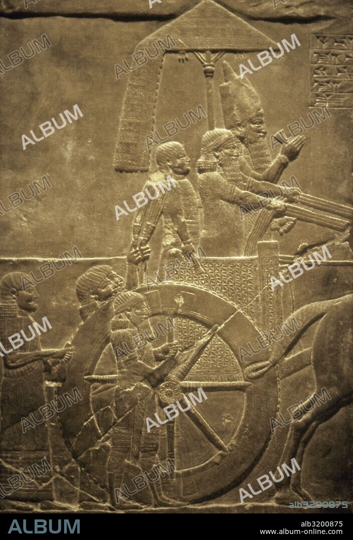 Palace of Ashurbanipal, Nineveh, Iraq. Ashurbanipal with his subjects in his chariot. Relief. Upper Mesopotamia. Neo-Assyrian Empire. 7th century BC. Louvre Museum. Paris, France.