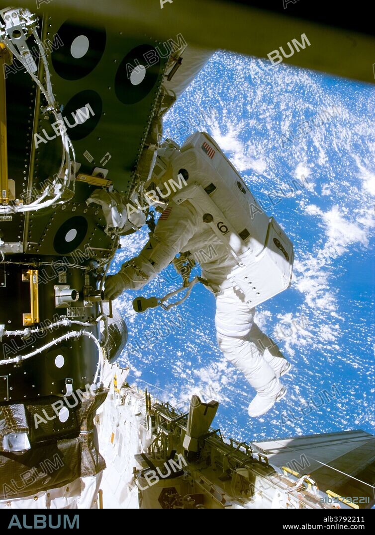 Astronaut James H. Newman is seen at a pressurized mating adapter during early moments of the first of three scheduled spacewalks on STS-88, the first mission of the Space Shuttle to the International Space Station, December, 1998. Astronauts Newman and Jerry L. Ross, both mission specialists, went on to mate 40 cables and connectors running 76 feet from the Zarya control module to the Unity node, with the 35-ton complex towering over Endeavour's cargo bay.