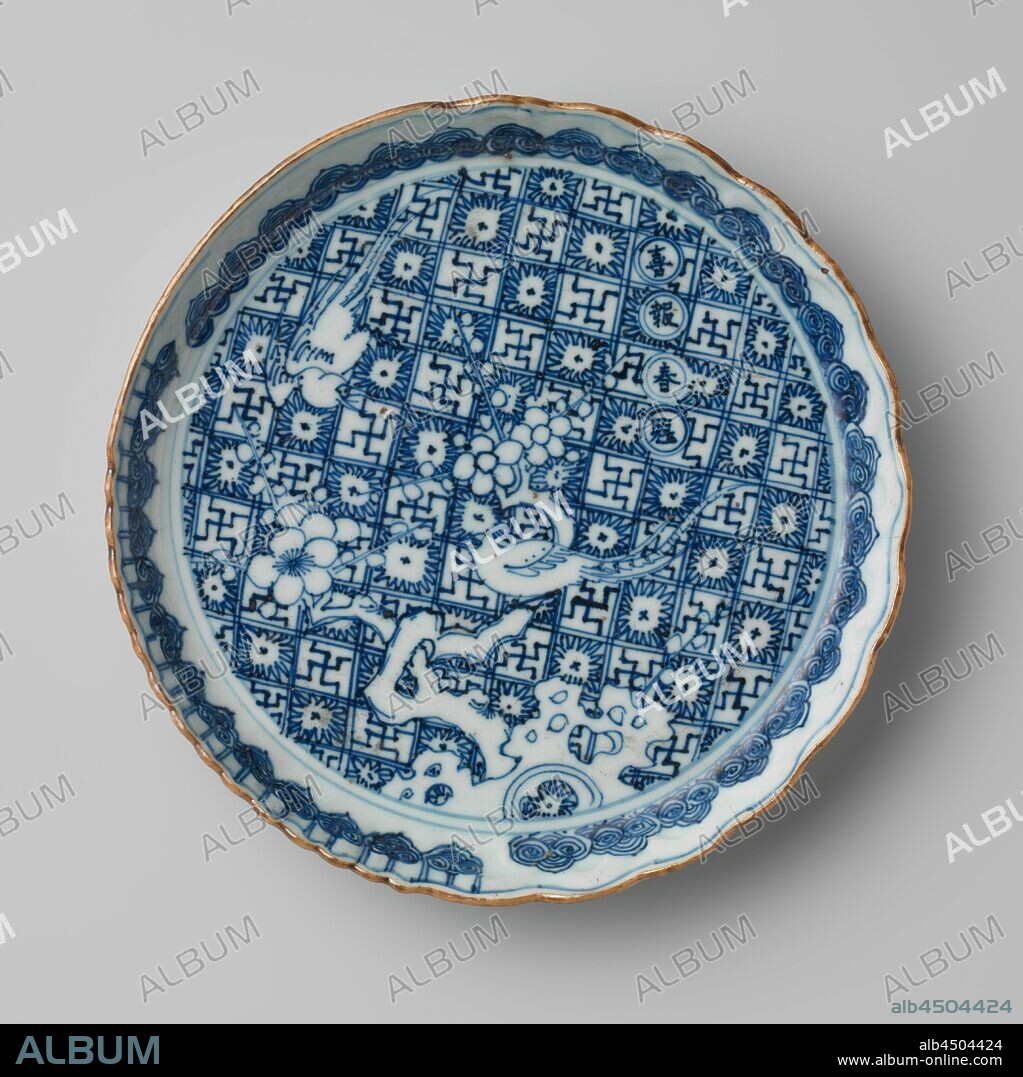 Saucer-dish with two pheasants on a prunus tree on a ground of flowers and swastikas, Porcelain dish with lobed edge, painted in underglaze blue. On the flat a pheasant on a prunus tree near a rock, a second pheasant is flying above the tree. The background with a grid pattern alternately filled with swastikas and stylized flowers. An inscription of four characters next to the tree. The inner wall with a band of ruyi motifs. The outer wall with a continuous border with birds. Marked on the bottom with 'fuku' in a square within a double circle. Baking sand on the foot ring. Arita, blue and white., anonymous, Japan, c. 1700 - c. 1799, Edo-period (1600-1868), porcelain (material), glaze, cobalt (mineral), vitrification, h 3.1 cm d 19.7 cm d 14.2 cm.