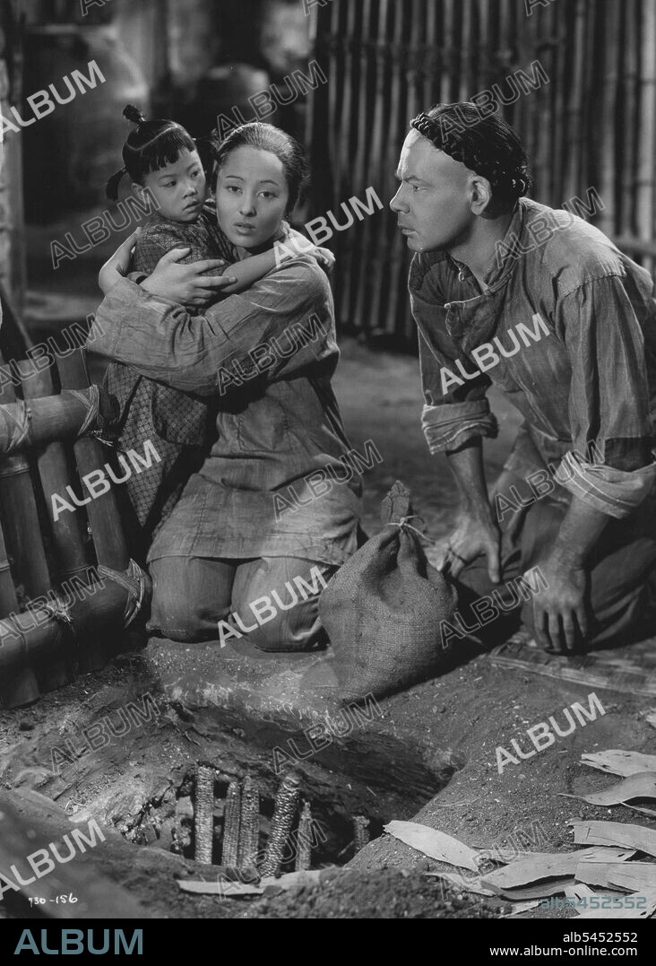 Movie - "The Good Earth".Paul Muni, Luise Rainer and "little Daughter" in the poignant 156 famine episode in Metro-Goldwyn-Mayer's "The Good Earth", directed by Sidney Franklin and produced by Irving G. Thalberg. August 03, 1936. (Photo by Minneapolis Star Library).