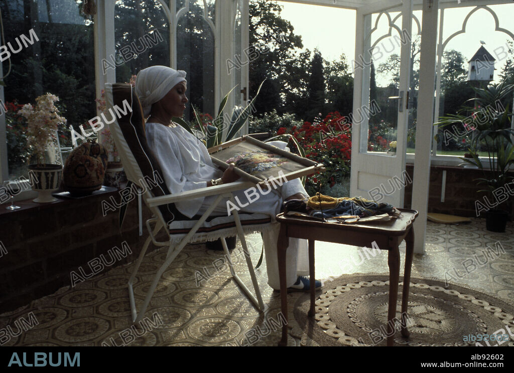Jan 01, 1980-London, England, United Kingdom-British jazz singer and actress CLEO LAINE DBE (Dame Commander of the Order of the British Empire) relaxing with a weaving at her Wavendon home, north of London 1980. Dame Cleo lane is married to jazz musician Johnny Dankworth, CBE.