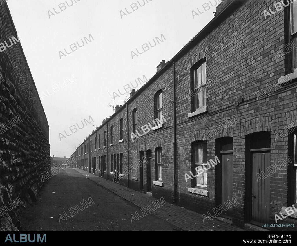 Terraced miners' housing, Denaby Main, South Yorkshire, mid 1960s. These houses were typical of the type of affordable housing constructed for the workforce. These were constructed in 1861 and stood until 1967. The houses were two up, two down with a back yard. Water was not installed until 1902 and gas powered the lighting until 1951 when electricity was installed.