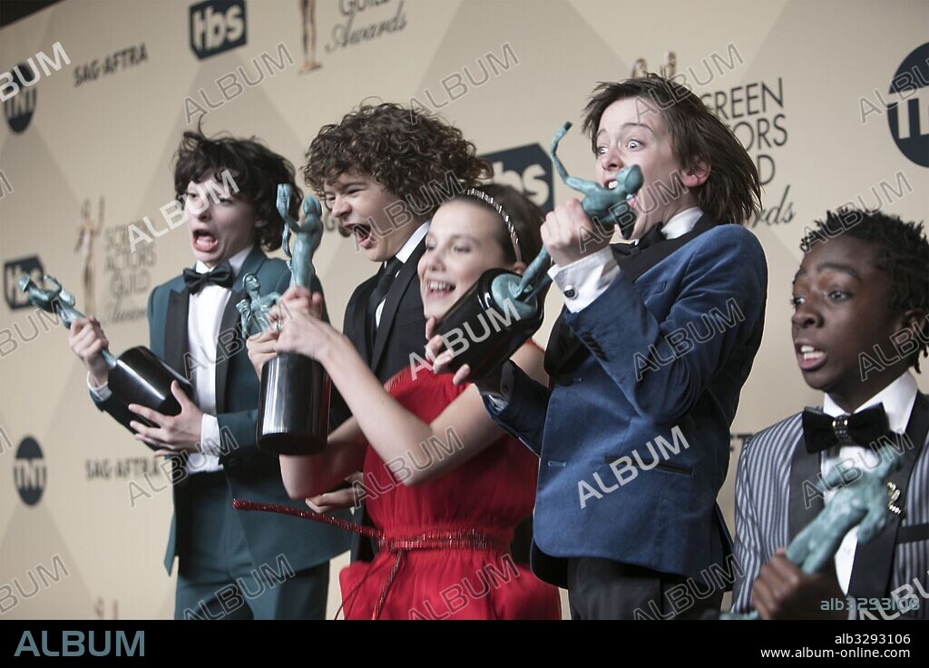 January 29, 2017 - Los Angeles, California, U.S - Actors Finn Wolfhard, Gaten Matarazzo, Millie Bobby Brown, Noah Schnapp, and Caleb McLaughlin, co-recipients of the Outstanding Performance by an Ensemble in a Drama Series award for 'Stranger Things,' pose in the Press Room of the 23rd Annual Screen Actors Guild Awards held at the Shrine Auditorium in Los Angeles, California, Saturday, January 29, 2017. 29/01/2017