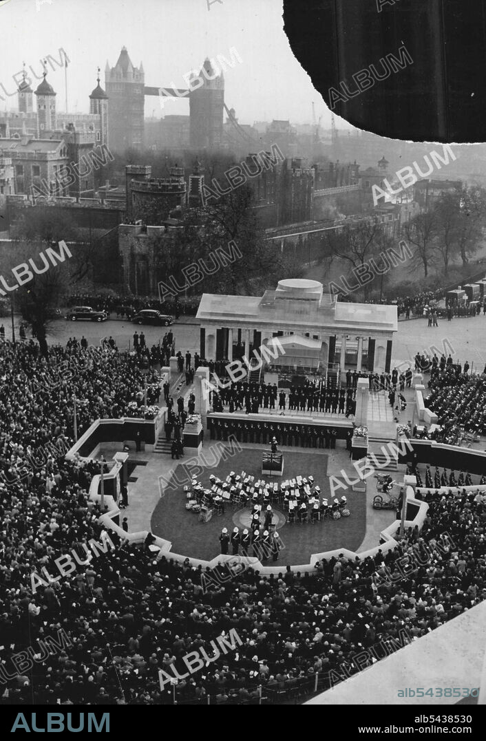 20,000 See The Queen Unveil Merchant Navy Memorial -- The scene at the unveiling ceremony. The Tower of London and Tower Bridge are seen in background. About 20,000 people saw the Queen, who was accompanied by the Duke of Edinburgh, unveil the Merchant Navy Memorial on Tower Hill, London. to-day (Saturday). She was accompanied by the Duke of Edinburgh. The memorial, built by the Imperial War Graves Commission to the design of Sir Edward Maufe, RA, honours 24,000 officers and men of the Merchan.