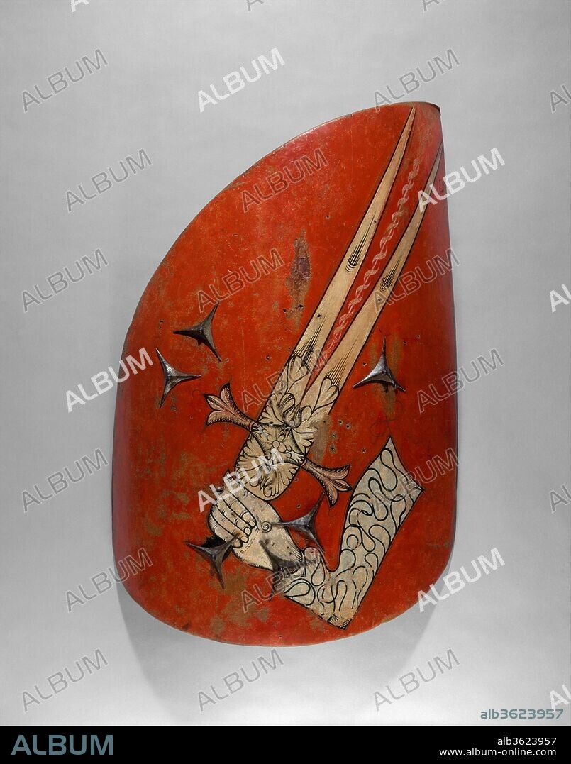 Three Hungarian-Style Shields. Culture: Eastern European. Dimensions: 42.50.29: H. 50 in. (127 cm); W. 20 in. (50.8 cm); 42.50.30: H. 45 in. (114.3 cm); W. 25 in. (63.5 cm); 49.57.1: H. 32 1/2 in. (82.55 cm); W. 21 5/8 in. (54.91 cm). Date: ca. 1500-1550.
These wing-shaped shields, with the distinctive upward-sweeping back edge, were the characteristic light-cavalry shields of Hungary. During the sixteenth century, the style was adopted across much of eastern Europe by both Christian and Islamic horsemen. The shield's elongated upper edge was designed to defend the back of the head and neck against cuts from a saber, the preferred cavalry weapon in that region.
The shield on the right is painted on its exterior with the double-bladed sword of the prophet Muhammad and on its interior with the Crucifix and instruments of the Passion. This unusual mix of Islamic and Christian symbols suggests that the shield was used in a tournament by a Christian warrior dressed in Muslim fashion. In these "Hungarian style" tournaments, the participants wore Hungarian and Turkish costumes and used sabers to strike off feathers attached to their opponents' helmets and to the apex of their painted shields. Even at a time when Turkish armies were a constant threat to eastern Europe, their costumes and tactics were imitated by their foes.