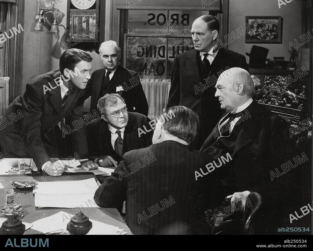 JAMES STEWART, LIONEL BARRYMORE and THOMAS MITCHELL in IT'S A WONDERFUL LIFE, 1946, directed by FRANK CAPRA. Copyright RKO.