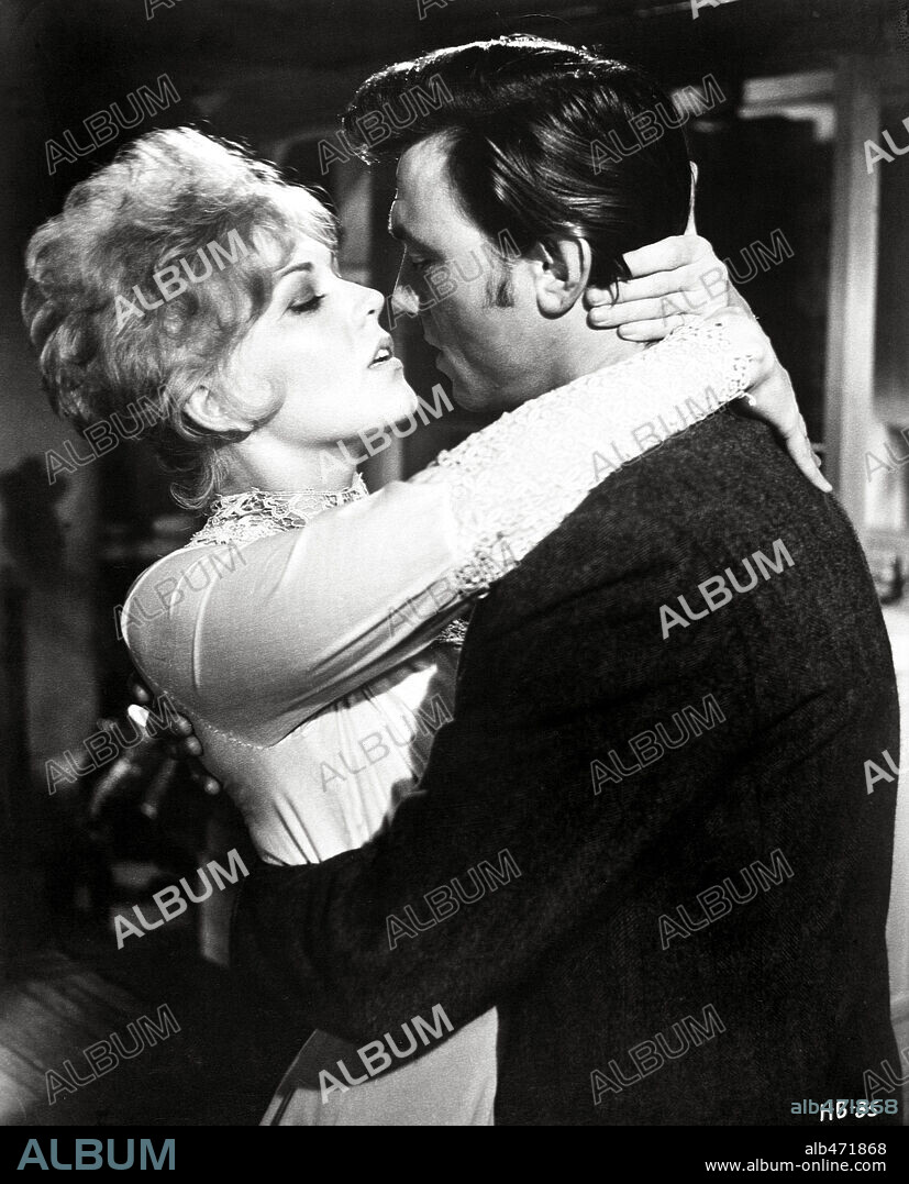 KIM NOVAK and LAURENCE HARVEY in OF HUMAN BONDAGE, 1964, directed by KEN HUGHES. Copyright M.G.M.