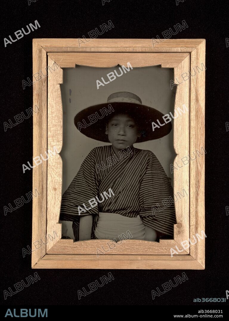 Kenji Morita. Artist: Fujita (Japanese, active 1880s). Dimensions: Image: 9.6 x 6.8 cm (3 3/4 x 2 11/16 in.)
Case: 1.3 x 11.1 x 8.3 cm (1/2 x 4 3/8 x 3 1/4 in.). Date: 1886.
When Japan opened its ports to the West in the 1850s, photography--called shashin, literally, a copy of truth--soon became widely available. High-end professional salons and open-air studios operated by itinerant practitioners offered portraits at every price range. While the popularity of ambrotypes, a positive photograph on glass, was short-lived in the United States, Japanese ambrotypes were in demand from the early 1870s until the end of the nineteenth century. These two ambrotype portraits depict a dreamy-eyed, fourteen-year-old student and a barefoot geisha with her attendant. Housed in poetry-inscribed kiri-wood boxes, they provide an intimate and rare glimpse of how modern Japanese society represented itself.