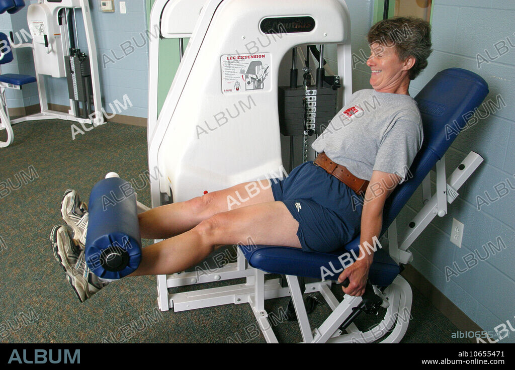 A woman engaged in weight training at Metro Park Splash Zone, Lorain County, Oberlin, Ohio.