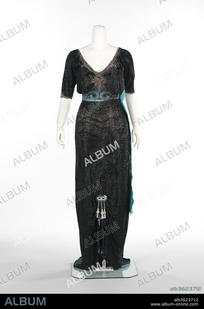 Evening dress. Culture: French. Designer: Georges Doeuillet (French, 1865-1929). Date: 1910-13.
Georges Doeuillet began his career as a silk merchant and then found his way to fashion design.  He is recognized for his highly detailed and elaborate dresses, which he modeled on live mannequins, a growing trend during the teens.  In 1928/1929, after his death, the House of Doeuillet was merged with the House of Doucet.  
The evening dress featured here is a glamorous French couture piece and a tour de force of beadwork.  Worn by one of New York's society ladies, Mrs. Frederick H. Prince, Jr., this gown would have made a stunning entrance at any social event.