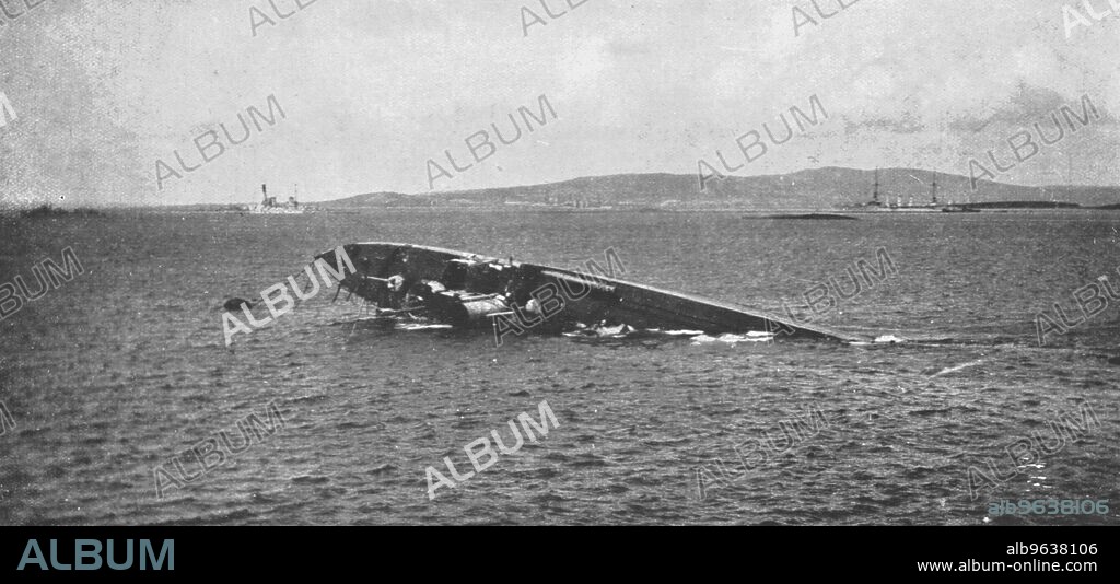'Le sabordage de la flotte allemande; Le 21 juin 1919, a Scapa Flow: un destroyer allemand sur le point de chavirer n'est plus maintenu a la surface que par l'air chasse dans les compartiments de l'avant par l'eau qui envahit la coque', 1919. From "L'Album de la Guerre 1914-1919, Volume 2" [L'Illustration, Paris, 1924].