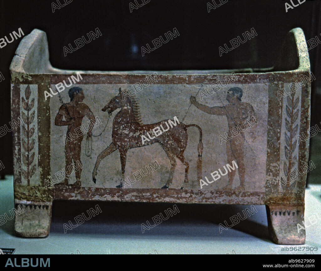 Etruscan funerary urn decorated with two men and a horse, preserved in the National Etruscan Museum of Villa Giulia in Rome.