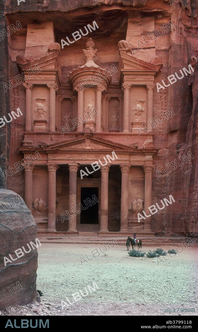 Petra, Jordan. Carved from rock, this treasury (Al Khazneh) was built by the Nabataeans, whose empire lasted from the 4th century BC to the 4th century AD. A long and narrow gorge must be traversed to reach these architectural ruins. This is a World Heritage site.