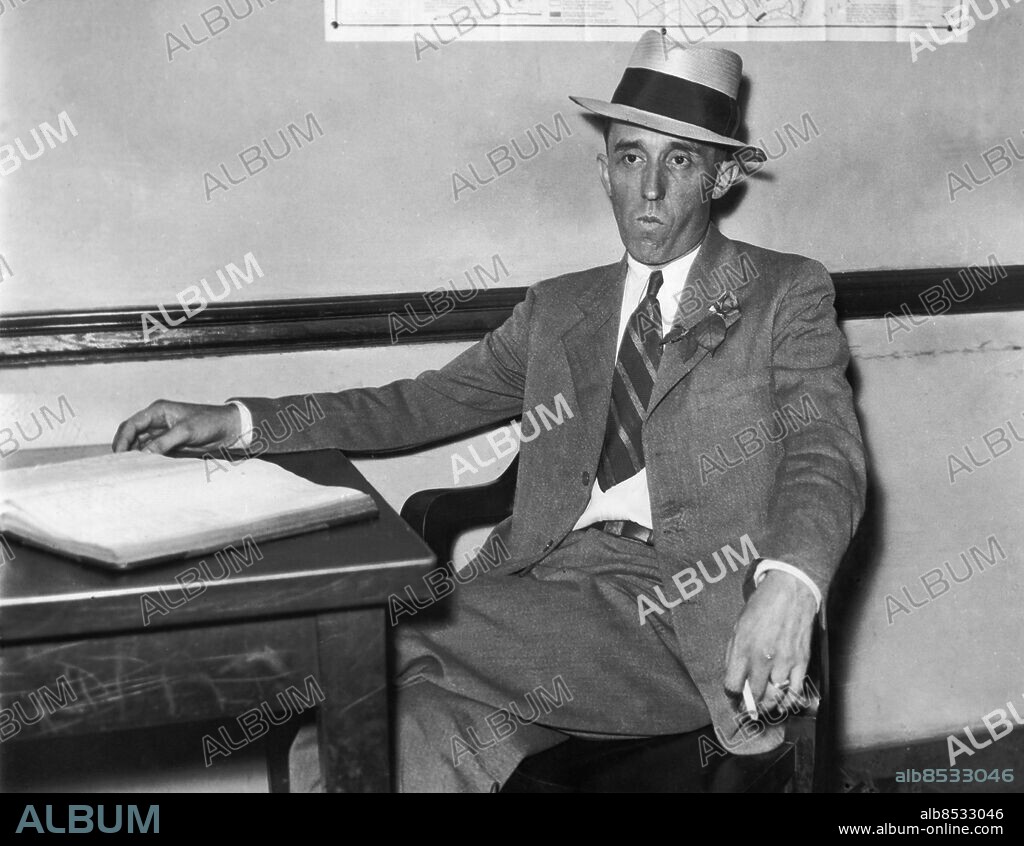 Orig. bildtext... INVESTIGATING DEATH OF REYNOLDS TOBACCO HEIR Picture above is Sheriff Transou Scott, in charge of the investigation of the shooting of Zachary Smith Reynolds, as he appeared at his desk in the courthouse at Winstone-Salem, N.C., July 10. Libby Holman, wife of the dead man, will be questioned again in connection with the shooting. Anm. Mordutredning Brottsutredningar CD619 persons: TRANSOU SCOTT sites: USA.