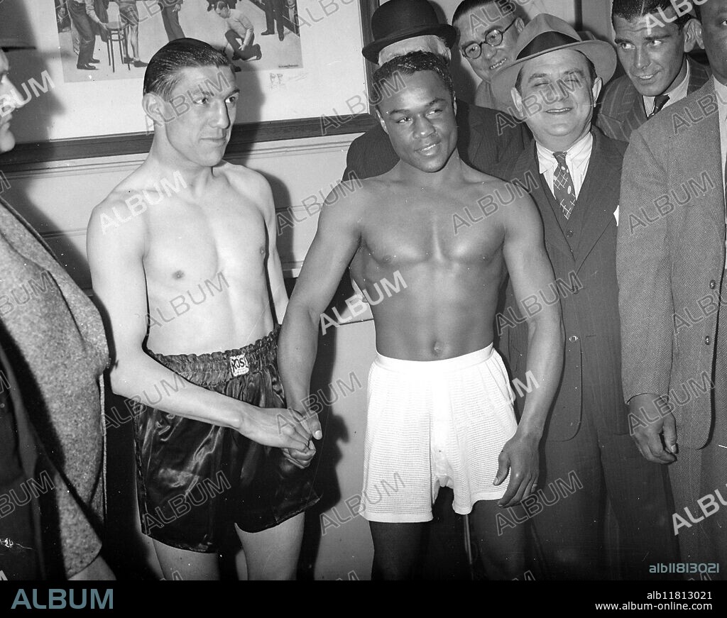 Weighing - in for their Harringay fight. Ernie Roderick and Henry Armstrong . 25 May 1939.