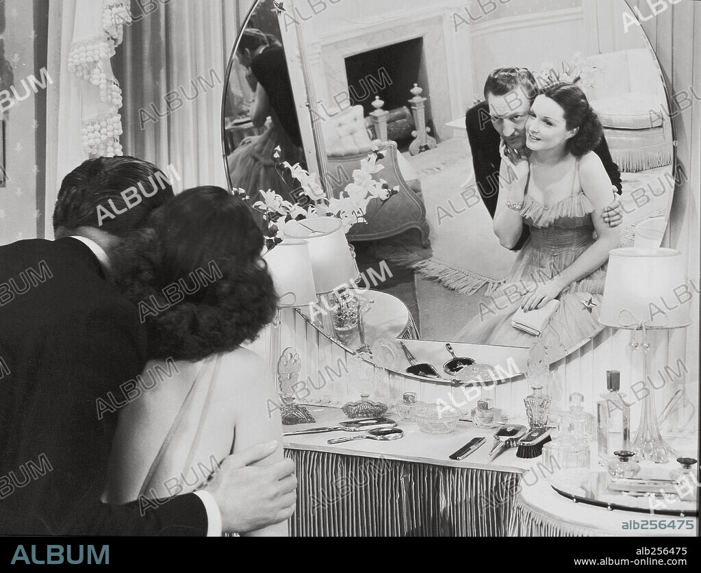 GAIL PATRICK and WARREN WILLIAM in WIVES UNDER SUSPICION, 1938, directed by JAMES WHALE. Copyright UNIVERSAL PICTURES.