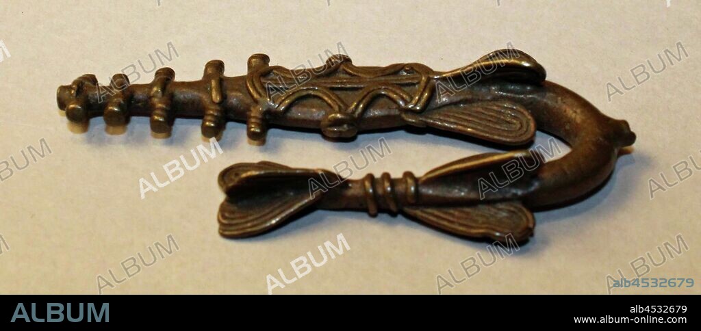Akan, African, Sawfish Gold Weight, 18th or 19th century, Brass, Overall: 5/16 × 2 3/8 × 1 3/8 inches (0.8 × 6 × 3.5 cm).