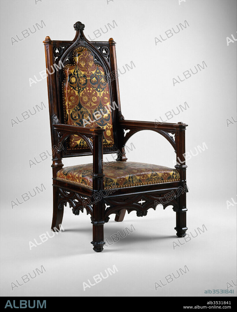 Armchair, Chair frame by the firm of Joseph-Pierre- François Jeanselme (1824–1860), Upholstery by the firm of Jacques-Michel Dulud, ca. 1850, French, Paris, Carved rosewood, leather, silk, serge, Overall: 51 1/2 × 25 5/8 × 24 1/2 in. (130.8 × 65.1 × 62.2 cm), Woodwork-Furniture, Chair frame by the firm of Joseph-Pierre- François Jeanselme (1824–1860, Upholstery by the firm of Jacques-Michel Dulud, The overall design of this armchair is taken directly from elements used in Gothic architecture, as are the prominent ogee-arch back surmounted by carved leaves and flanked by spandrels cut with trefoils, and the molded details of the posts, arms, supports, and legs, as well as the pierced skirt imitating tracery.