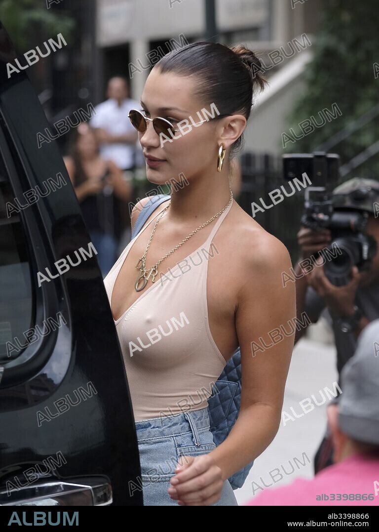 August 28, 2017 - New York, New York, United States - Model Bella Hadid wears a body suit and short skirt as leaves her sister Gigi's apartment on August 28 2017 in New York City. 28/08/2017