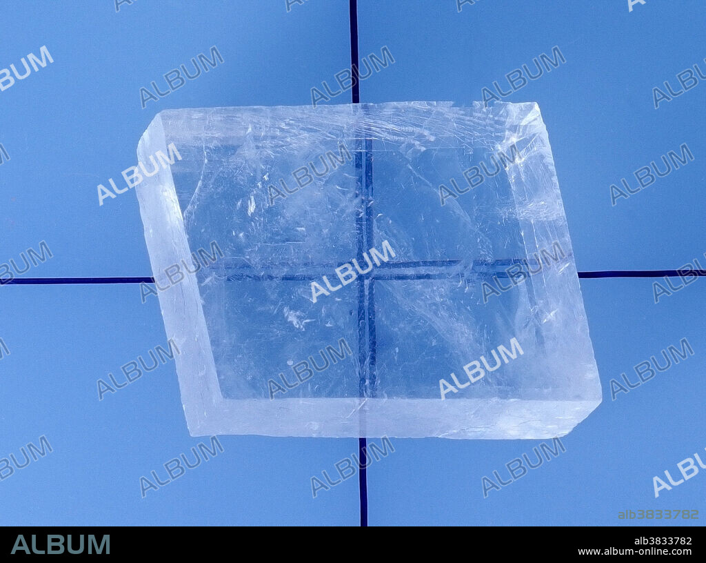 Calcite crystal showing birefringence (double refraction).