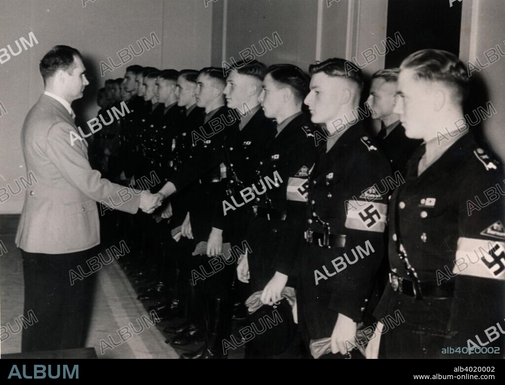 Nazi Deputy Führer Rudolf Hess meeting members of the Hitler Youth, Germany, January 1939.