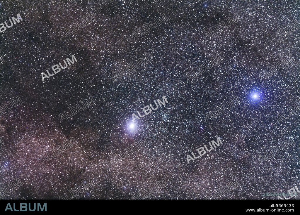 Alpha Centauri, the closest star system to the Sun (at left and aka Rigel Kentaurus) and Beta Centauri (at right, aka Hadar) in Centaurus, and together known as the Pointer Stars. The open cluster NGC 5617 is to the right of Alpha. The field simulates a binocular field of view.