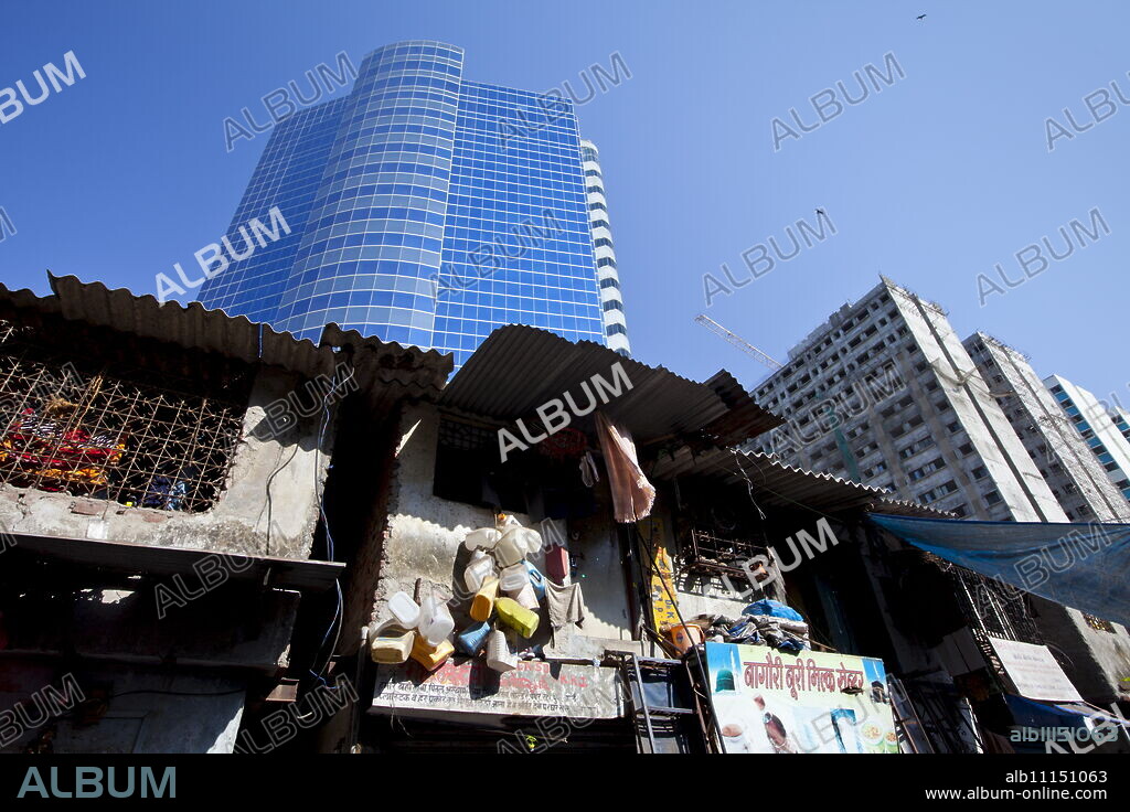 Essar House office development for Essar Group by slums in Mahalaxmi area of Mumbai, India shows contrast of rich and poor.