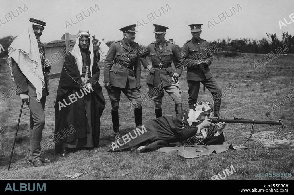 Saudi Arabia. the Emir of the Transjordan tries the elephant rifle of the English soldiers. 1934.