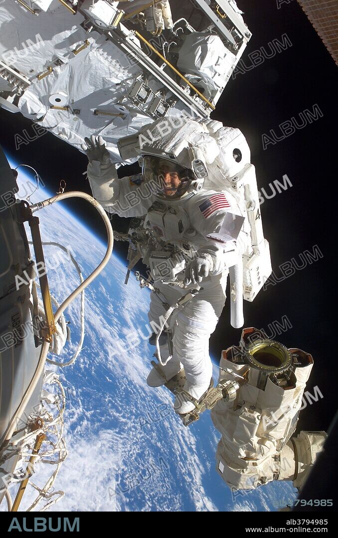 Astronaut Rex J. Walheim is attached to the International Space Station's robotic arm during an STS-110 spacewalk in April 2002. This spacewalk was the first time the station robotic arm was ever used to maneuver spacewalkers around the station. During this mission Walheim performed two EVAs totaling 14 hours and 5 minutes.