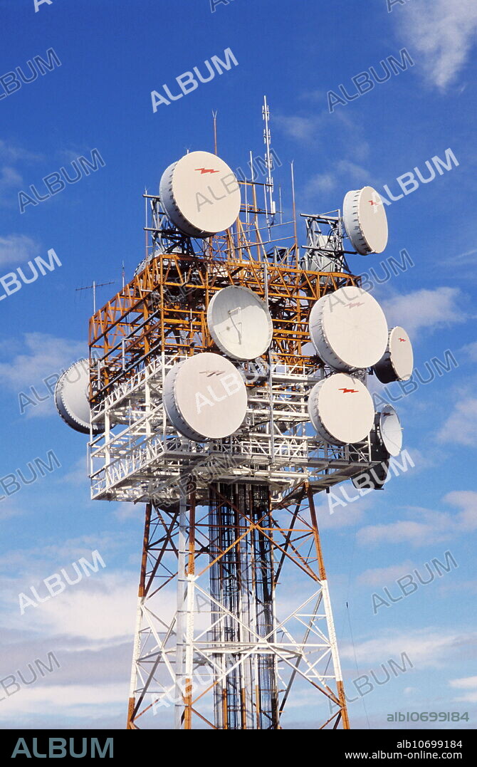 Microwave antennae on a support tower. These are used to transmit and receive communications data using microwave radiation. Mobile telephones are an example of devices that communicate this way. The signals are relayed through a large network of antennae that are mounted on towers (or masts) like these. The masts are usually around 15 metres high, but larger masts and antennae are needed for more powerful signals over larger distances. These antennae are in Brisbane, Australia.
