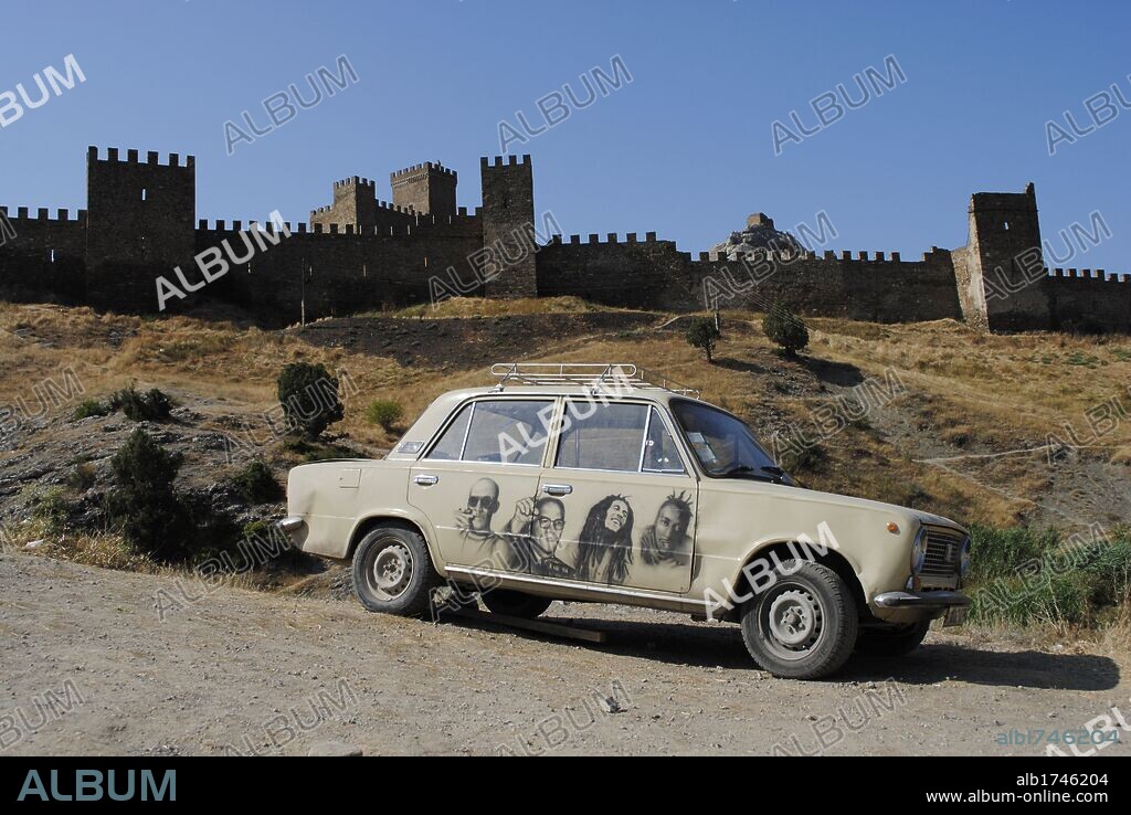 Ukraine. Autonomous Republic of Crimea. Sudak. Car parked outside the Genoese medieval Fortress.