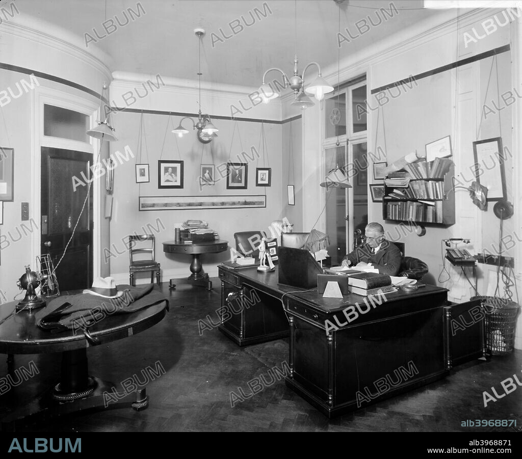 An editorial office at the 'Morning Post', Inveresk House, London, 1920, built for the newspaper in 1907 by Mewes & Davis. Note the early telephone beside the desk.