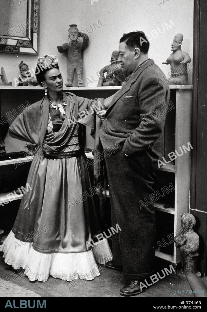 Circa 1945: Frida Kahlo with his husband the Mexican artist Diego Rivera in her studio in Mexico City.