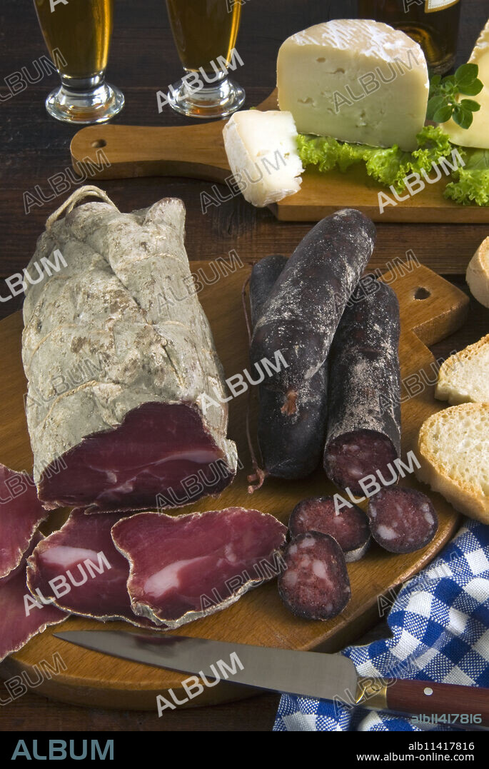 Motsetta (Motzetta) (Mocetta), chamois or beef meat salted, seasoned and dried, Boudin sausages and goat cheese, Italy, Europe.