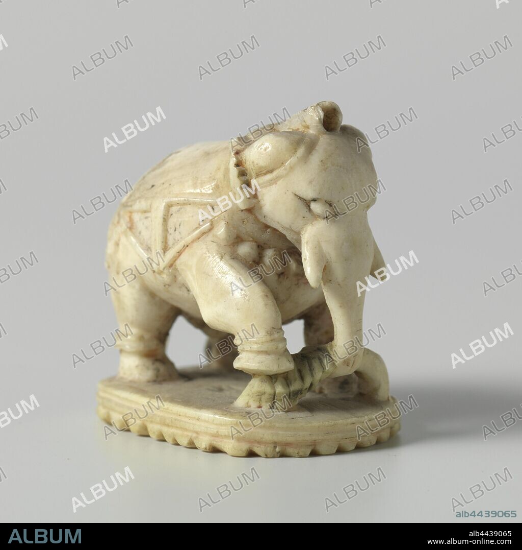 Elephant, Figurine of an elephant chess piece. The elephant is standing on an oval pedestal. He has a large branch in the trunk, he has put his right leg on the branch. The elephant is wearing a decorative rig and rings around the legs, indicated in low relief. remnants of red and green paint, Jean Theodore Royer, India (possibly), c. 1760 - c. 1780, ivory, cutting, h 3.6 cm × w 3.3 cm × d 2.7 cm.